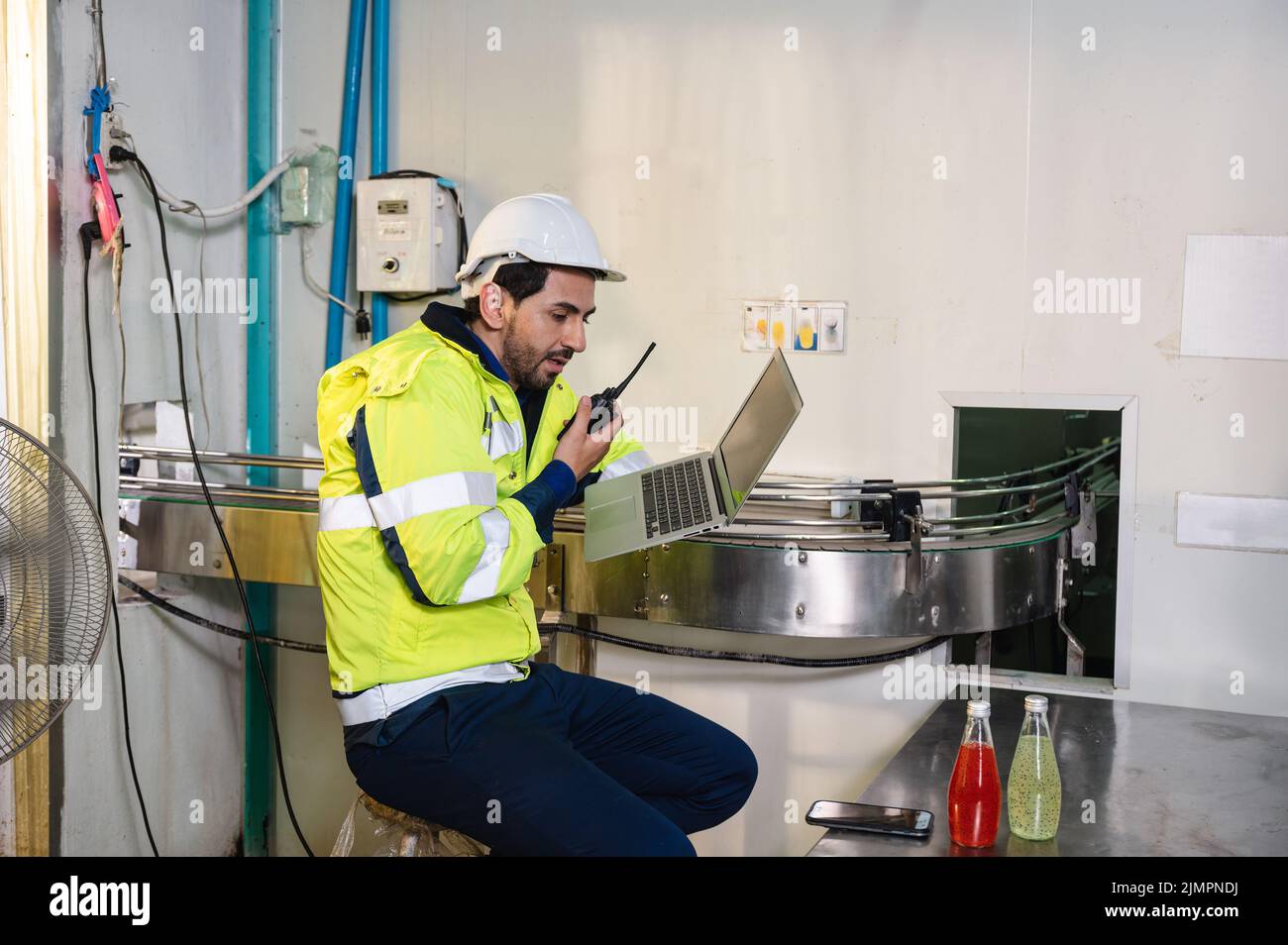 Caucasian engineer man in safety uniform checking and reporting quality