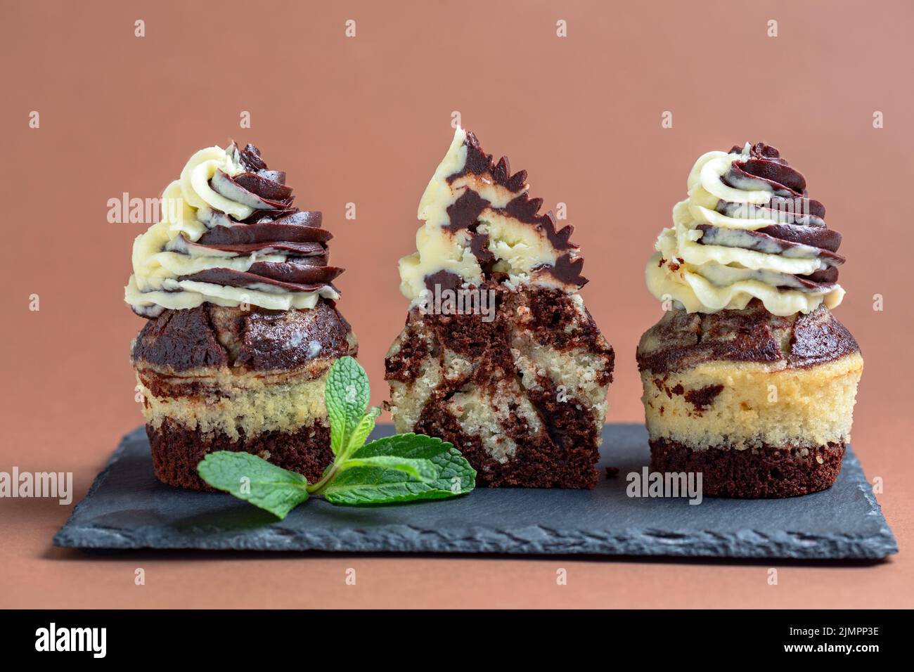 Marble chocolate and vanilla cupcakes. Stock Photo