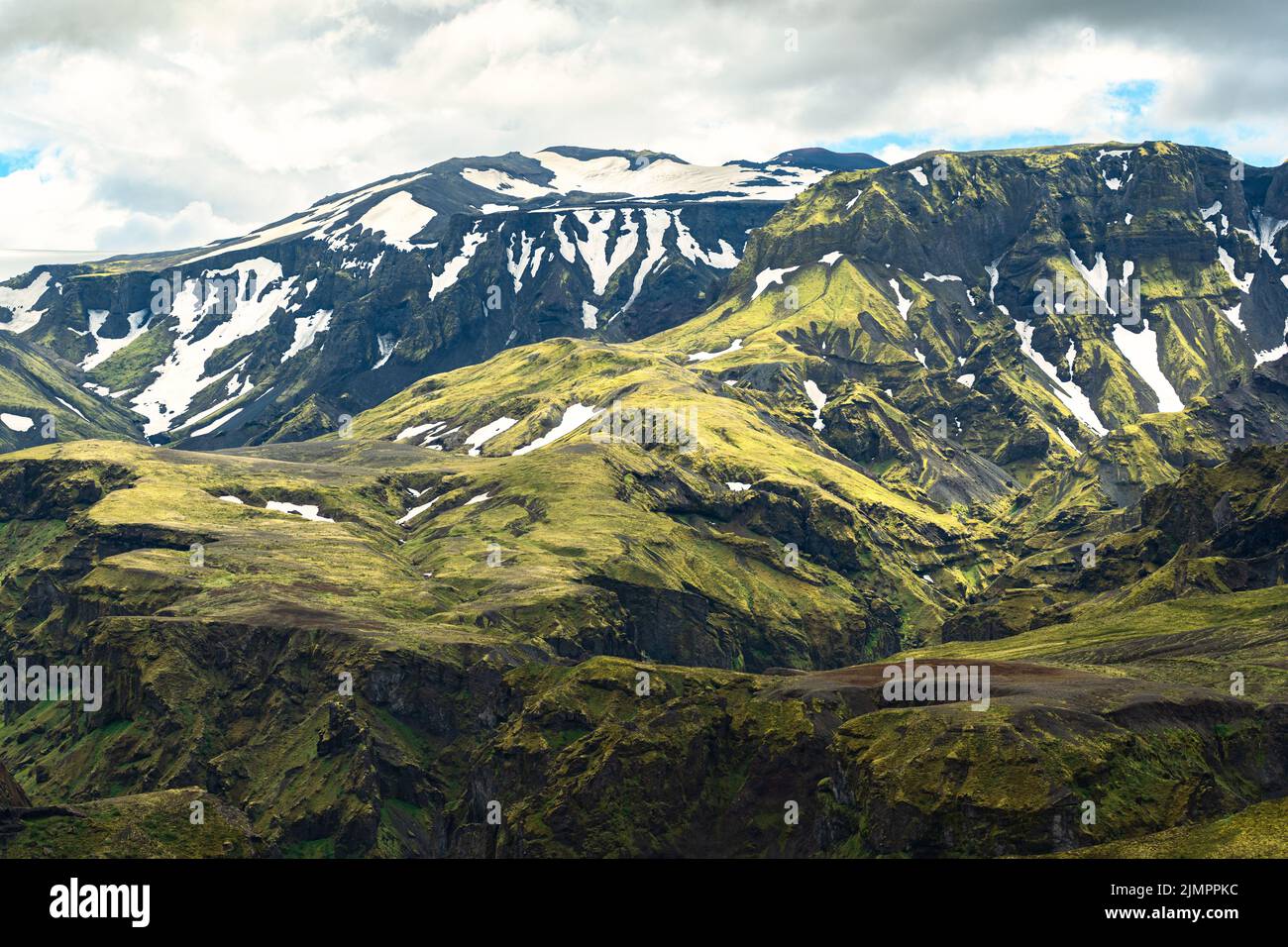 Landscape of green mountain with moss rough texture and snow covered in