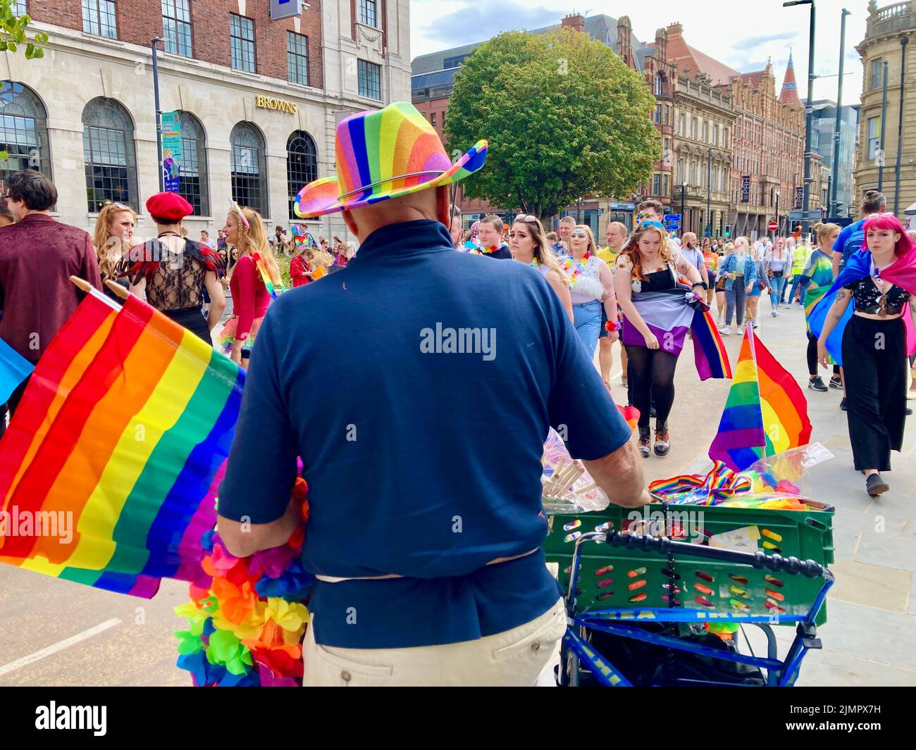 Leeds Pride 2022 celebrations as a crowd gather at Millenium Square for the beginniLeng of the parade. Celebrating gay people & wider LGBTQ community. Stock Photo