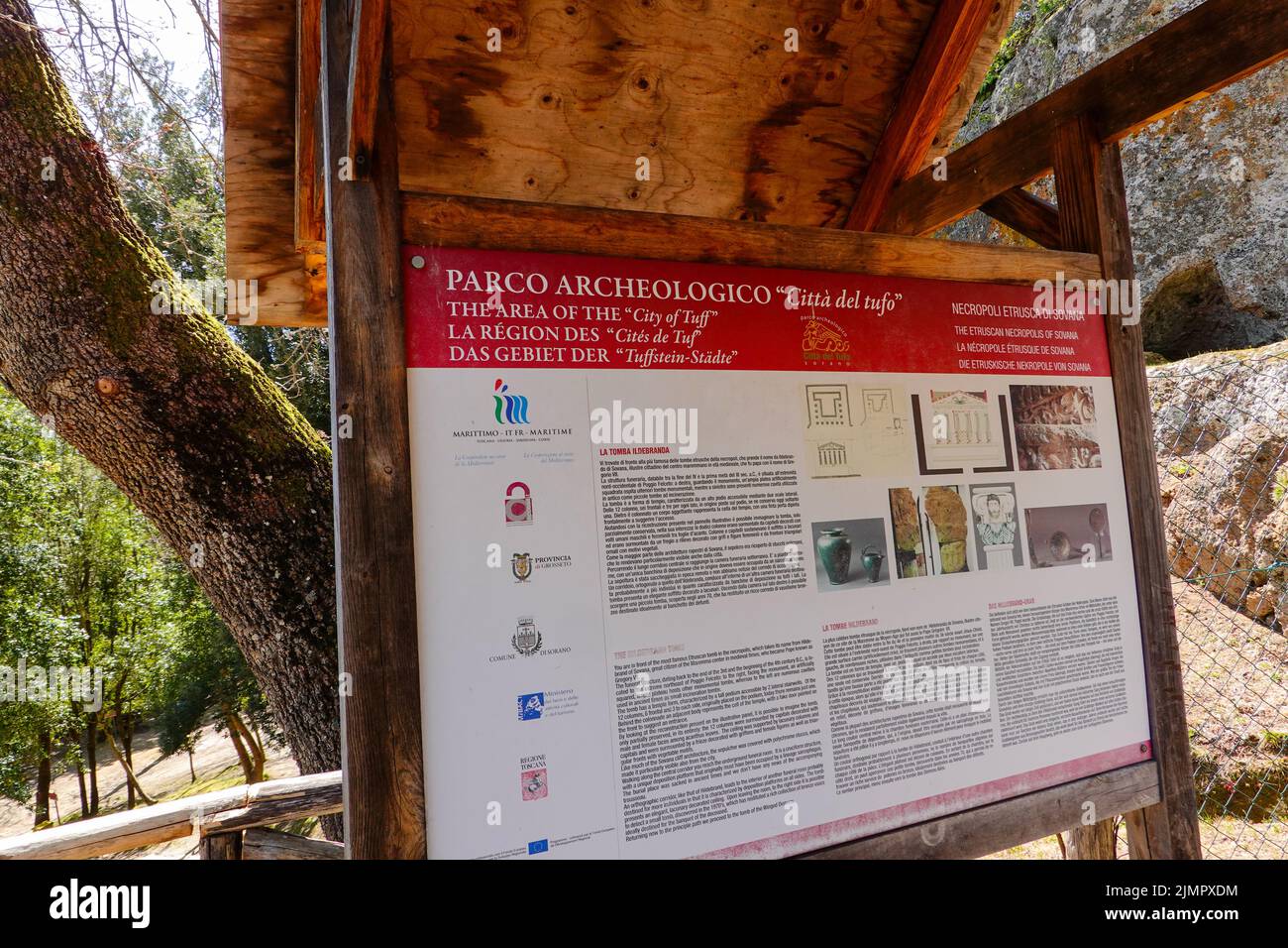 Sign at the Archeological Park, near Sovana in Maremma, at place of Tuscany's most significant Etruscan tombs, cut from the tufa rock face. Stock Photo