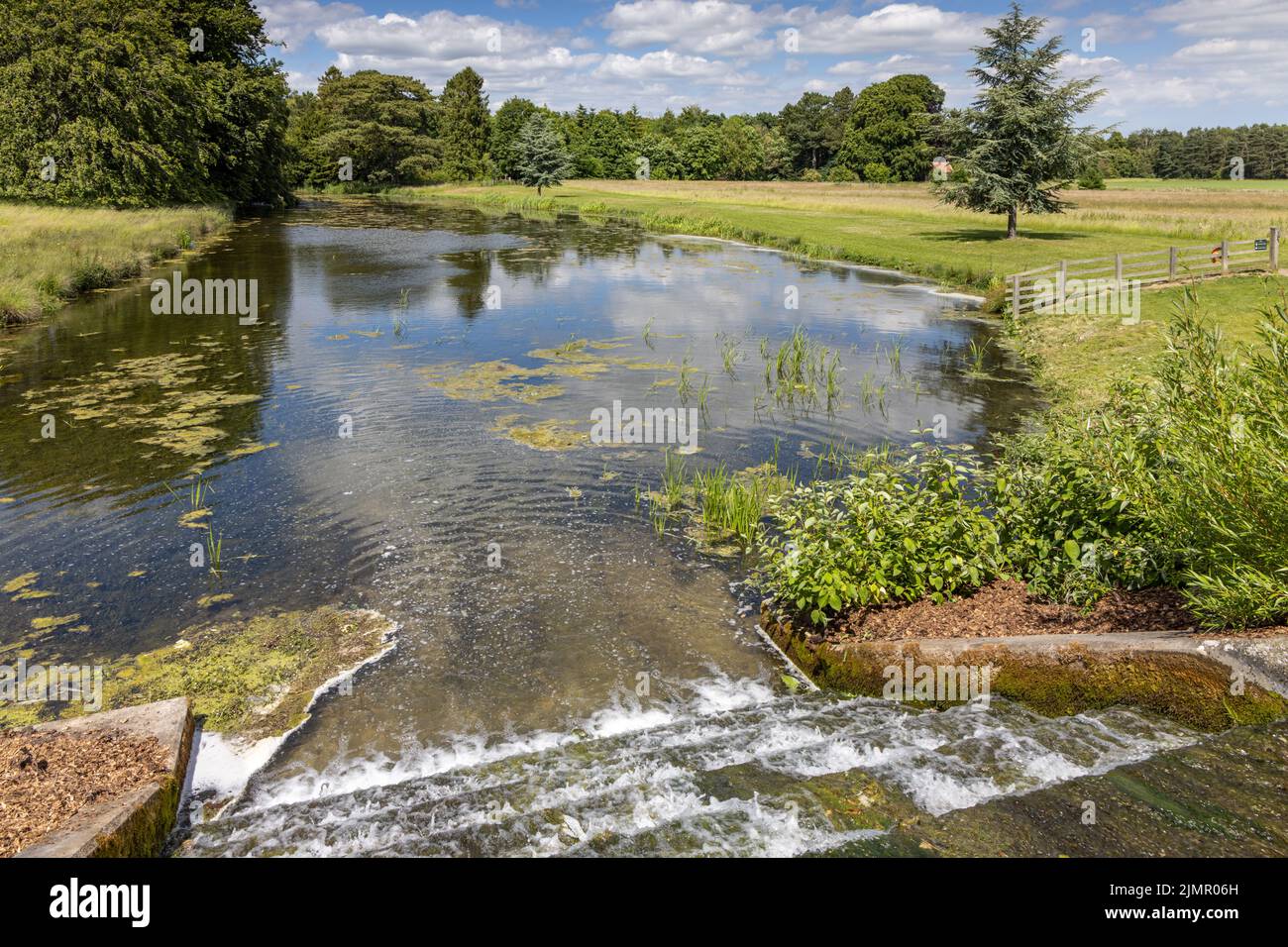 Parkland and wier at Scampston, designed by Capability Brown, Scampston Hall,  North Yorkshire, England. Stock Photo