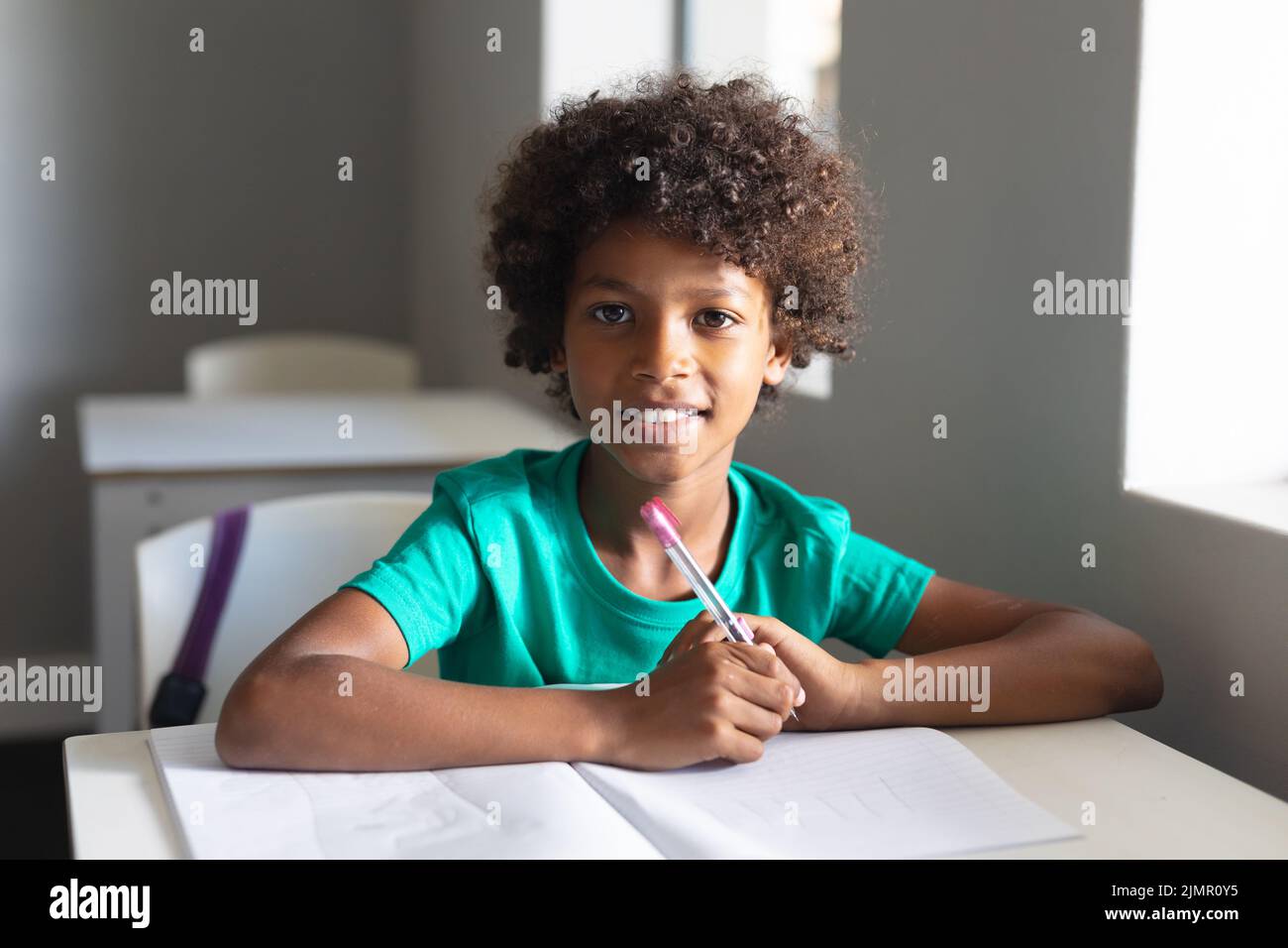 African boy writing desk hi-res stock photography and images - Alamy