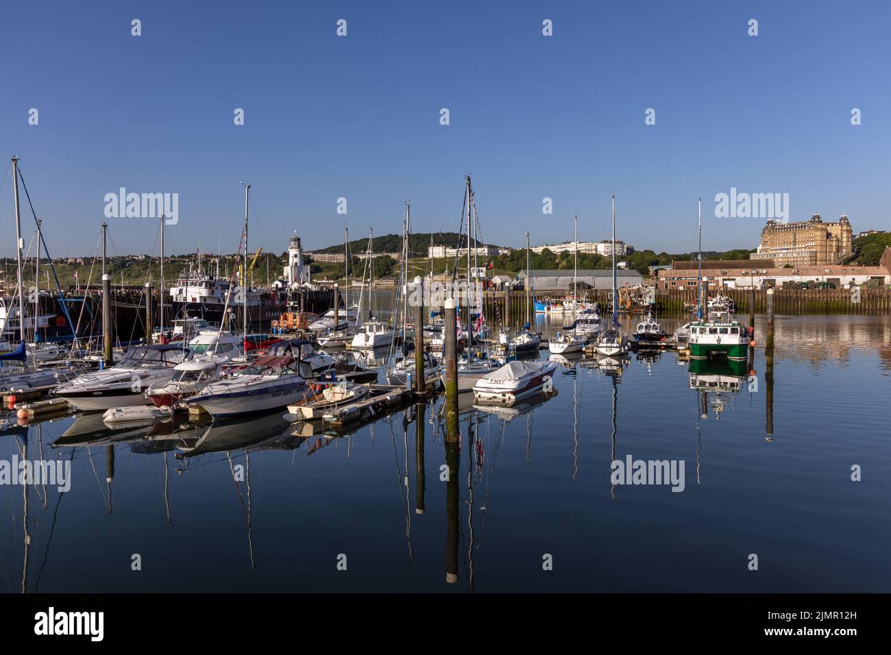 Boats and yachts moored in Scarborough harbour on the North Yorkshire Coast in England, on a gorgeous summer morning. Stock Photo