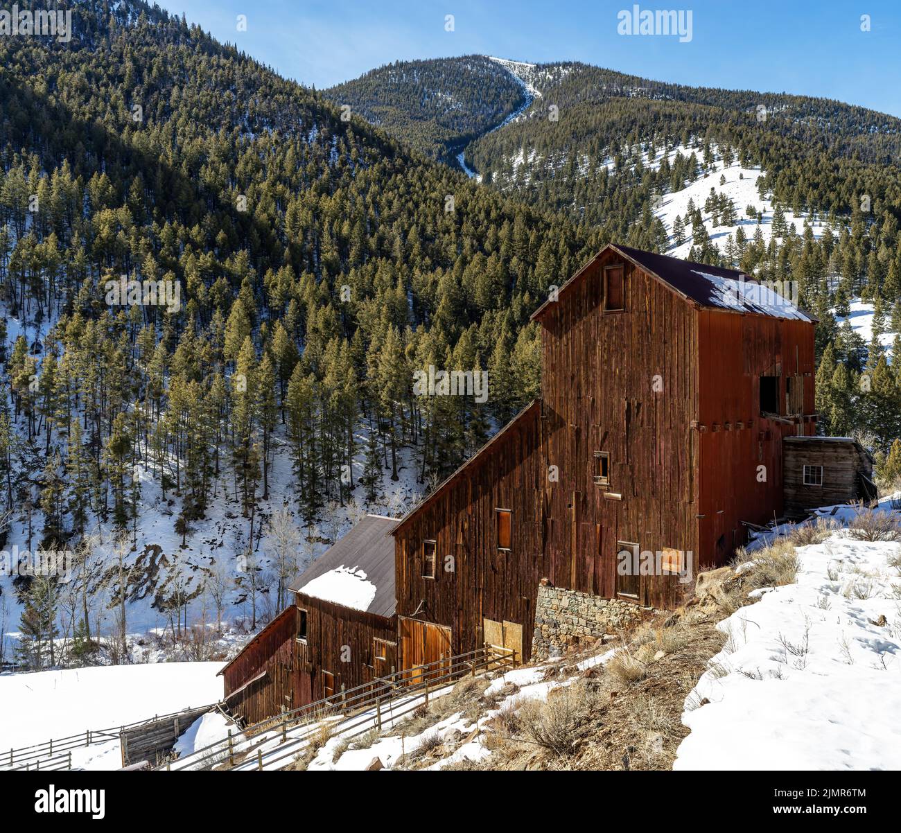 Hillside mining building at Bayhorse Idaho in winter Stock Photo