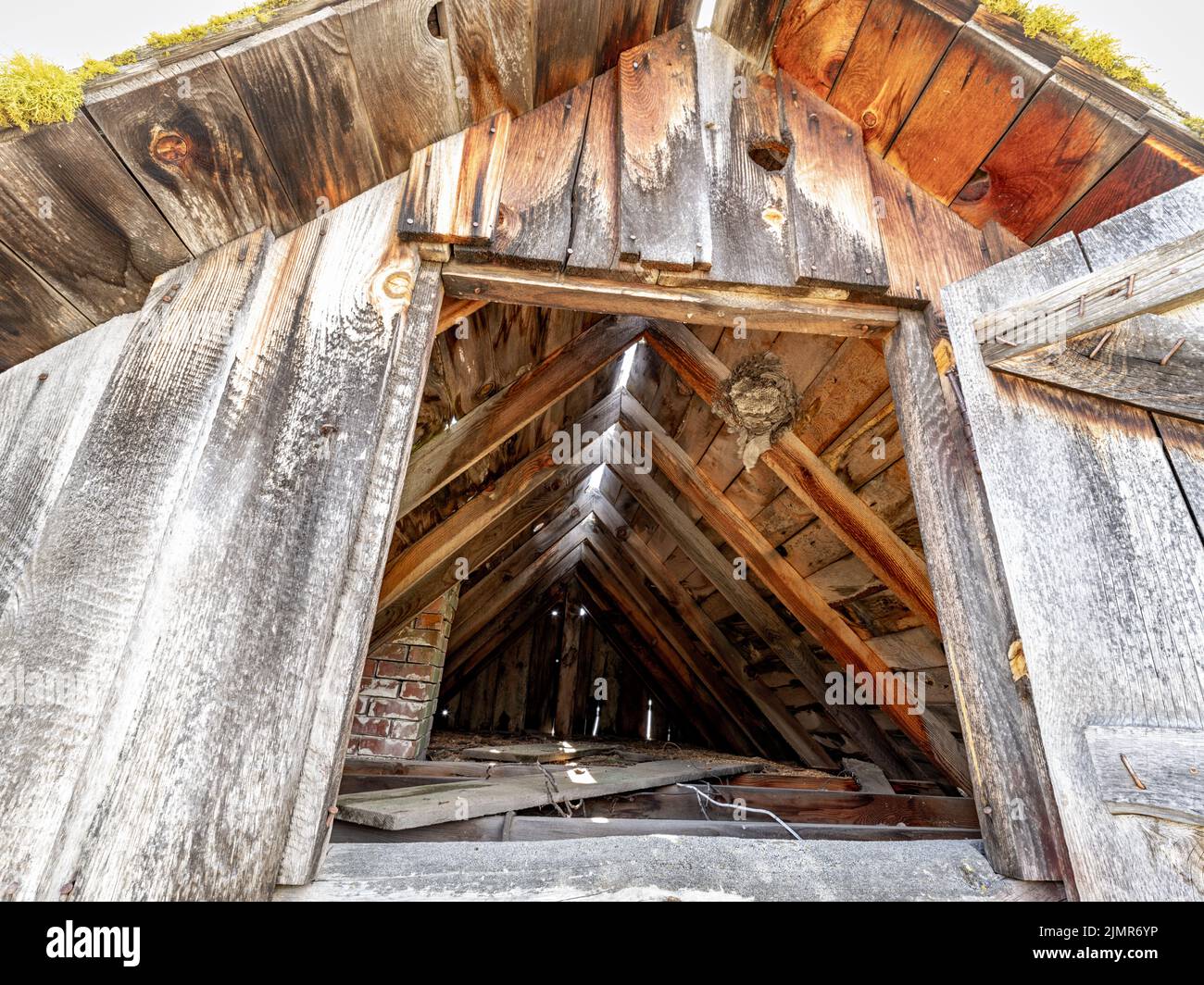 Attic beehive in an old wooden structure Stock Photo