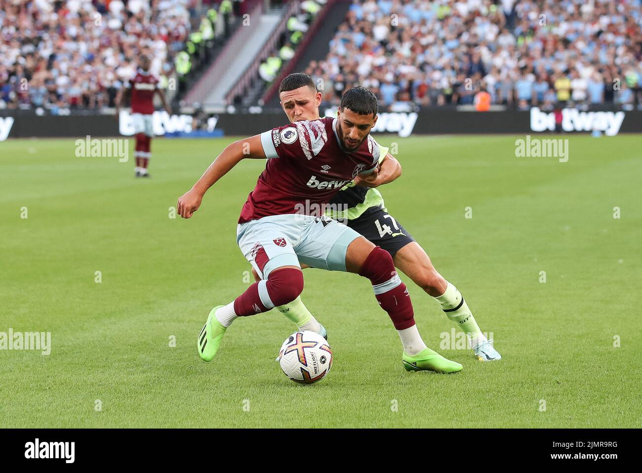 London, UK. 07th Aug, 2022. Sad Benrahma of West Ham United is challenged by Phil Foden of Manchester City during the Premier League match between West Ham United and Manchester City at the London Stadium, Queen Elizabeth Olympic Park, London, England on 7 August 2022. Photo by Ken Sparks. Editorial use only, license required for commercial use. No use in betting, games or a single club/league/player publications. Credit: UK Sports Pics Ltd/Alamy Live News Stock Photo