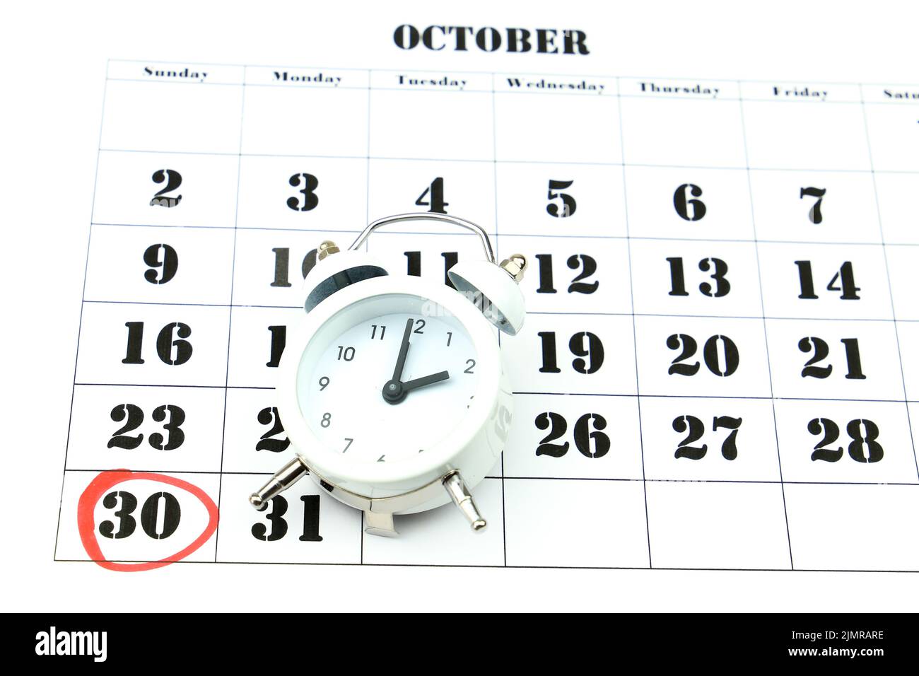 Clock marking winter time change over october calendar Stock Photo Alamy