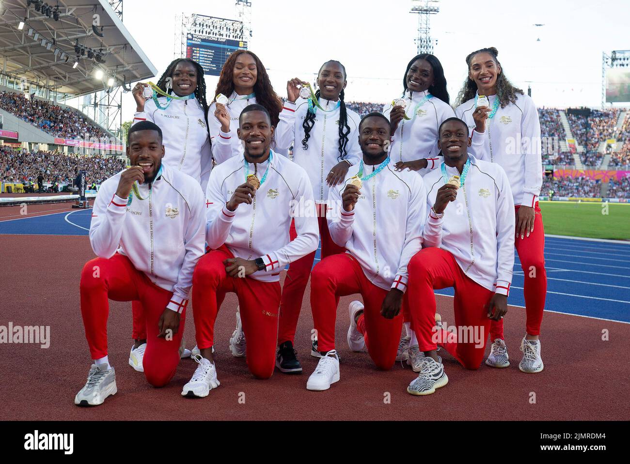 Birmingham, UK. 7th Aug, 2022. The Men and Women's 4x100m relay teams pose together for a photo after collected their medals during Day 10 of the Commonwealth Games at Alexander Stadium, Birmingham. Picture credit should read: Paul Terry Credit: Paul Terry Photo/Alamy Live News Stock Photo