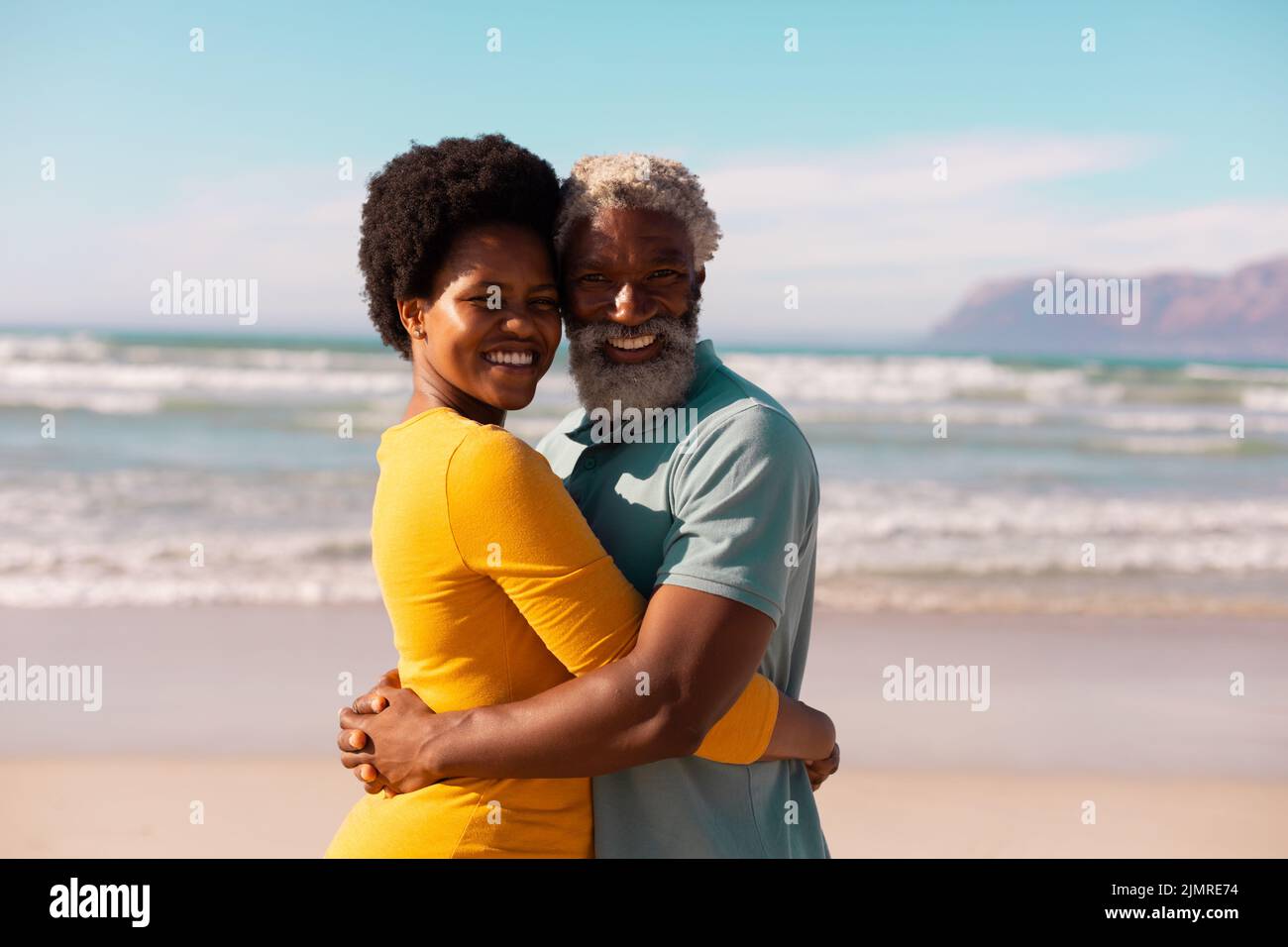Portrait of happy african american couple embracing while standing ...