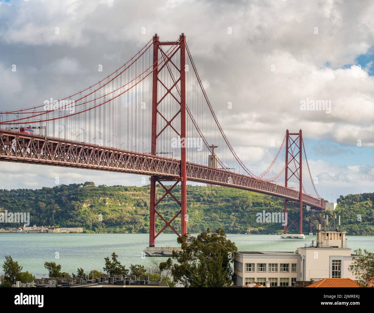Famous 25 de Abril Bridge in Lisbon, Portugal. Stock Photo