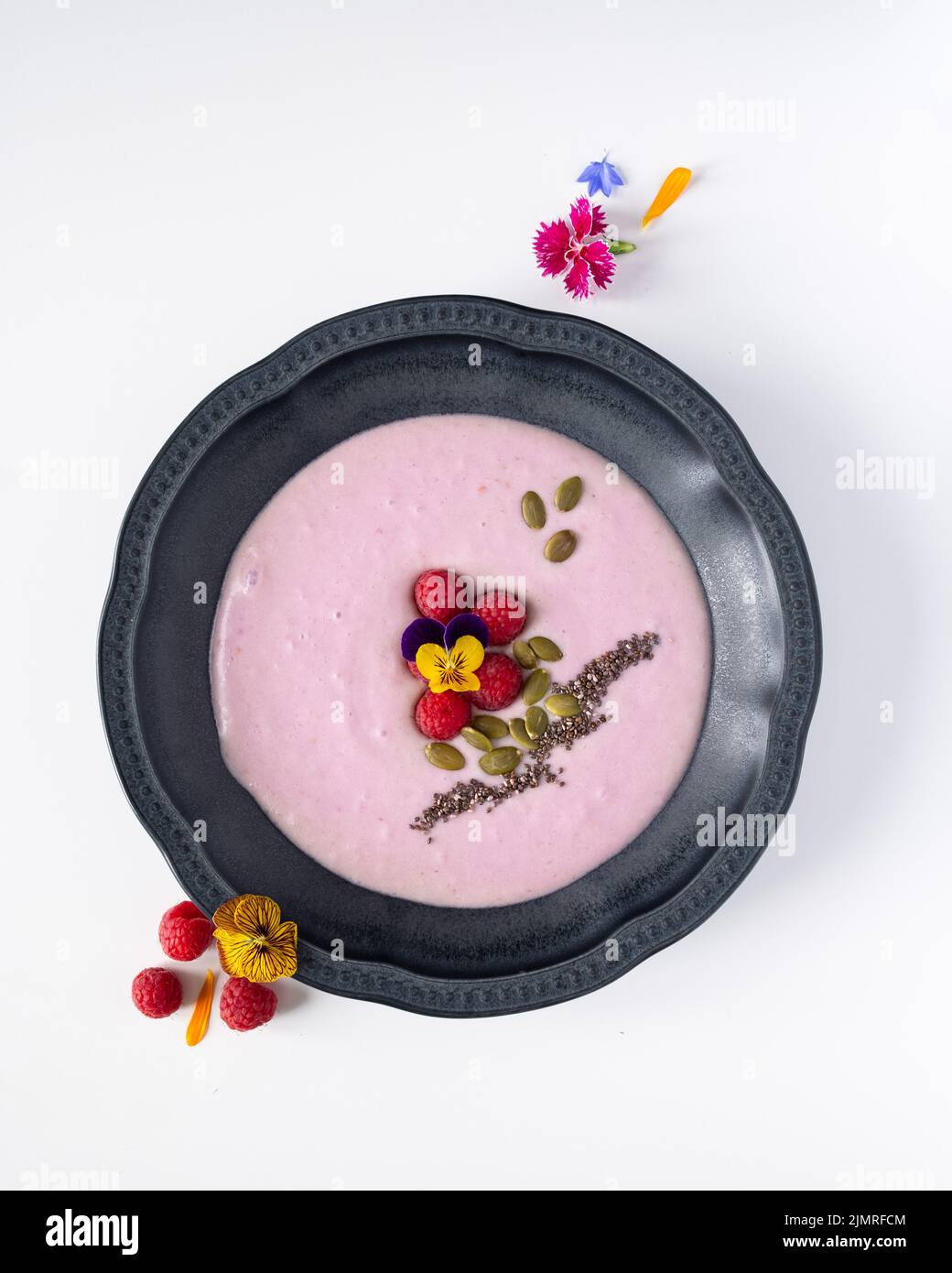 Edible flowers on smoothie Stock Photo Alamy