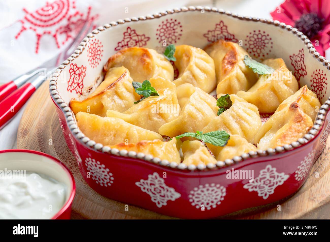 Baked dumplings with cottage cheese close up. Stock Photo