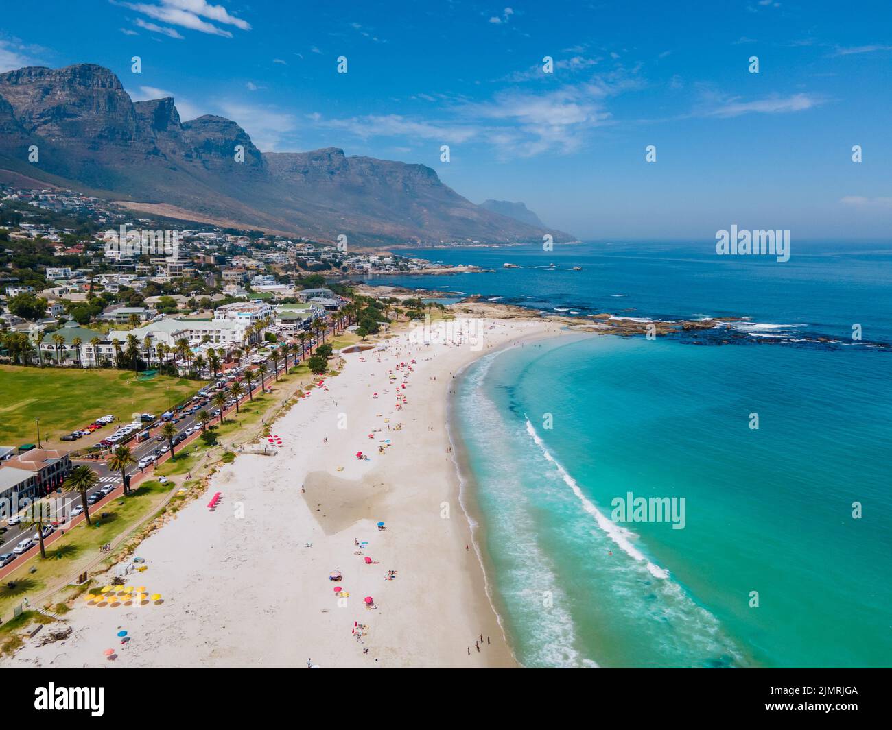 View from The Rock viewpoint in Cape Town over Campsbay, view over Camps Bay with fog over the ocean Stock Photo