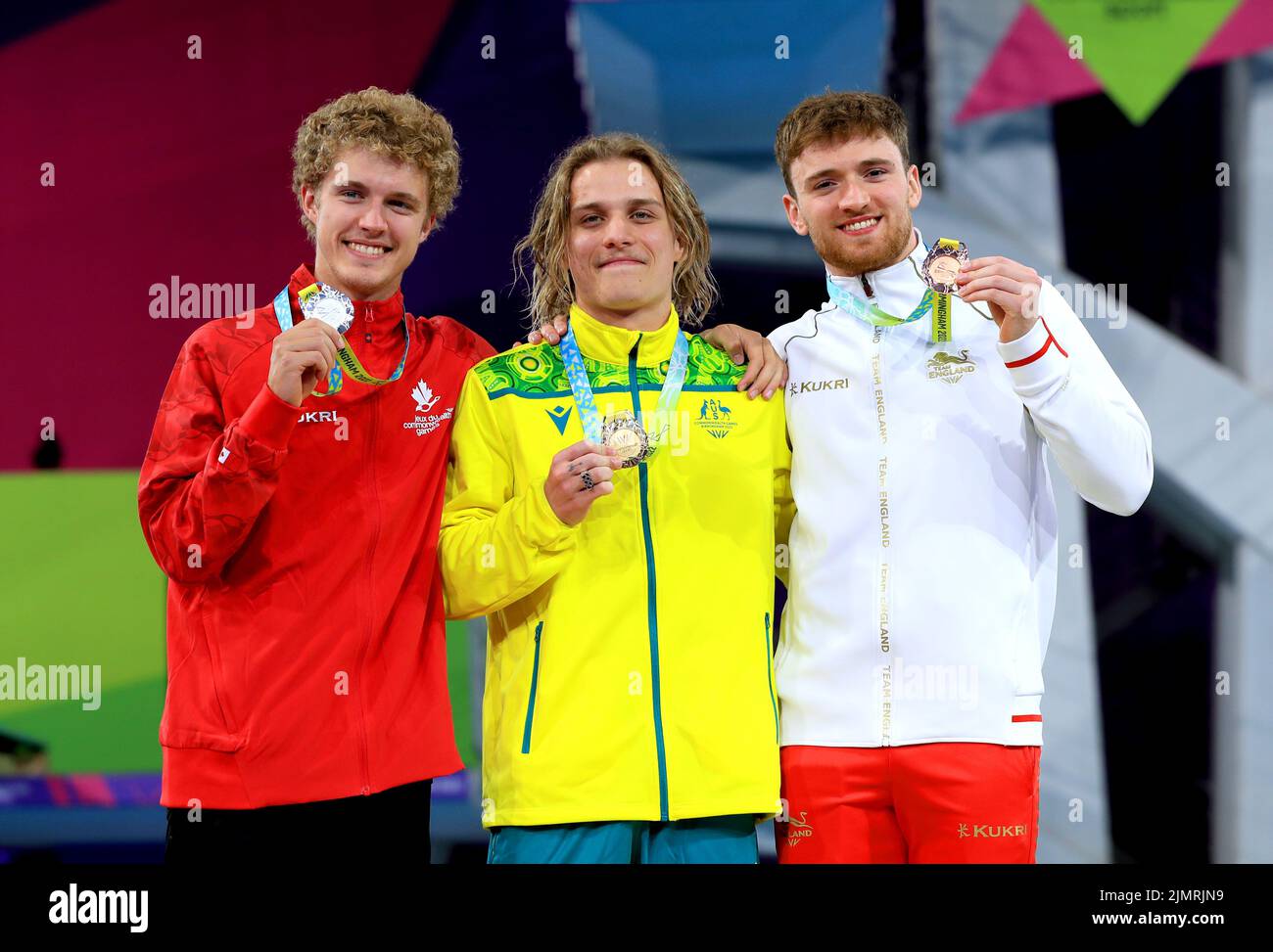 Australia's Cassiel Emmanuel Rousseau (centre) celebrates with his gold medal alongside Canada's Rylan Mackenzie Wiens (left) who finished second to take silver and England's Matthew Lee (right) who took bronze in the Men's 10m Platform Diving Final at Sandwell Aquatics Centre on day ten of the 2022 Commonwealth Games in Birmingham. Picture date: Sunday August 7, 2022. Stock Photo