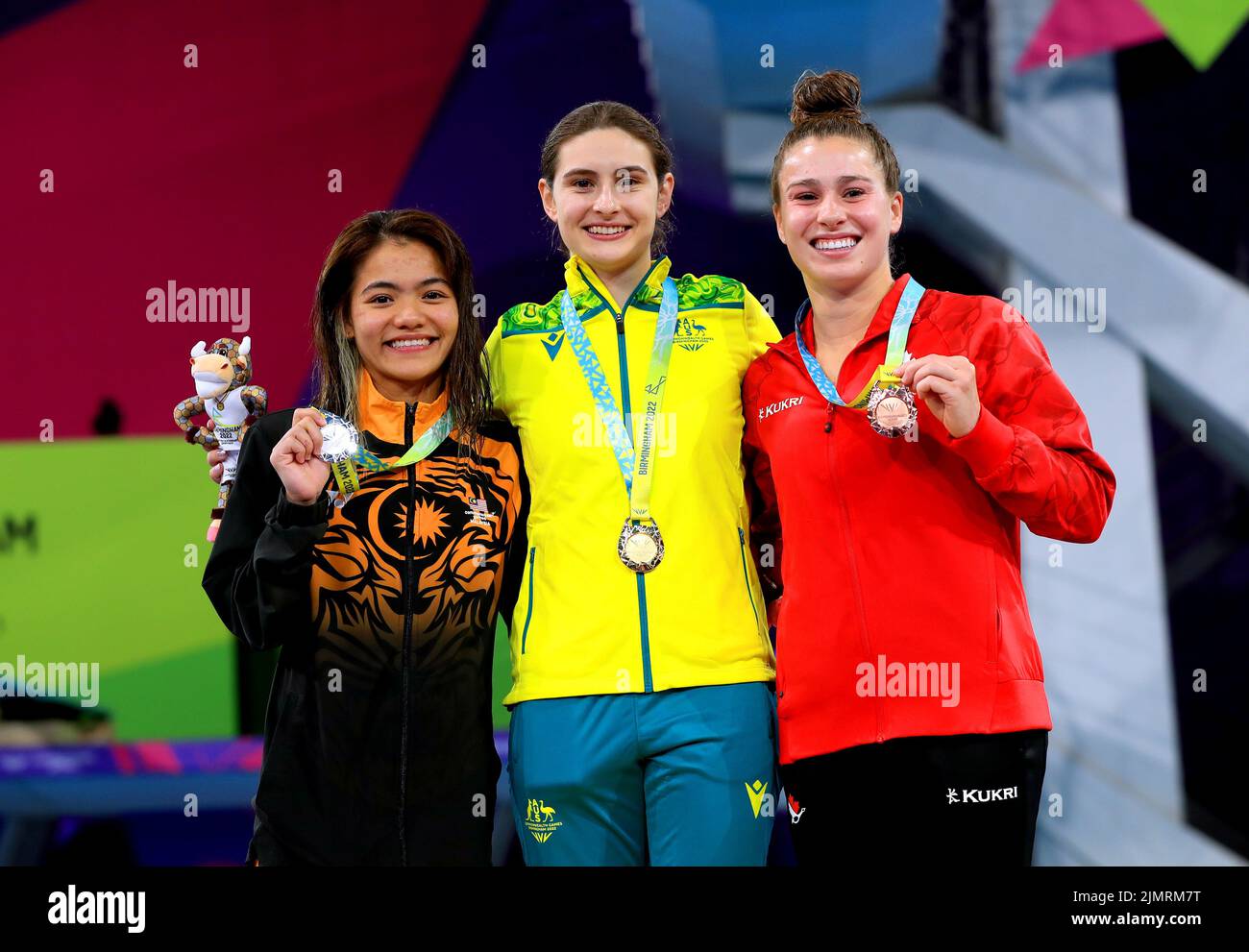 Australia's Maddison Keeney (centre) celebrates with her gold medal alongside Malaysia's Nur Dhabitah Binti Sabri (left), who finished second to take silver and Canada's Mia Jolie Doucet Vallee, who took bronze in the Women's 3m Springboard Diving Final at Sandwell Aquatics Centre on day ten of the 2022 Commonwealth Games in Birmingham. Picture date: Sunday August 7, 2022. Stock Photo