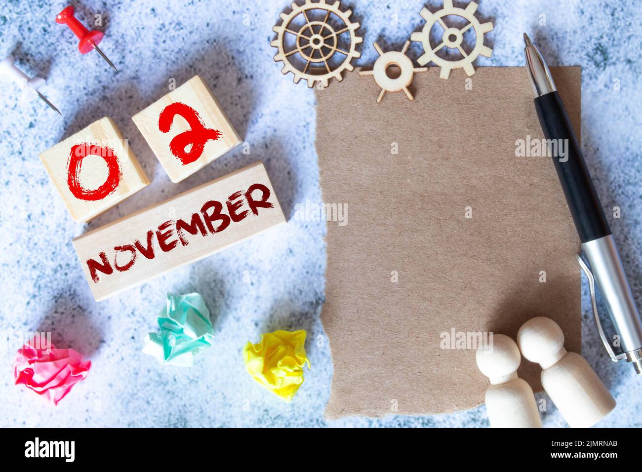 November 2. Day 2 of month, Cube calendar with date, empty frame on light blue background. Place for your text. Autumn month, day of the year concept. Stock Photo