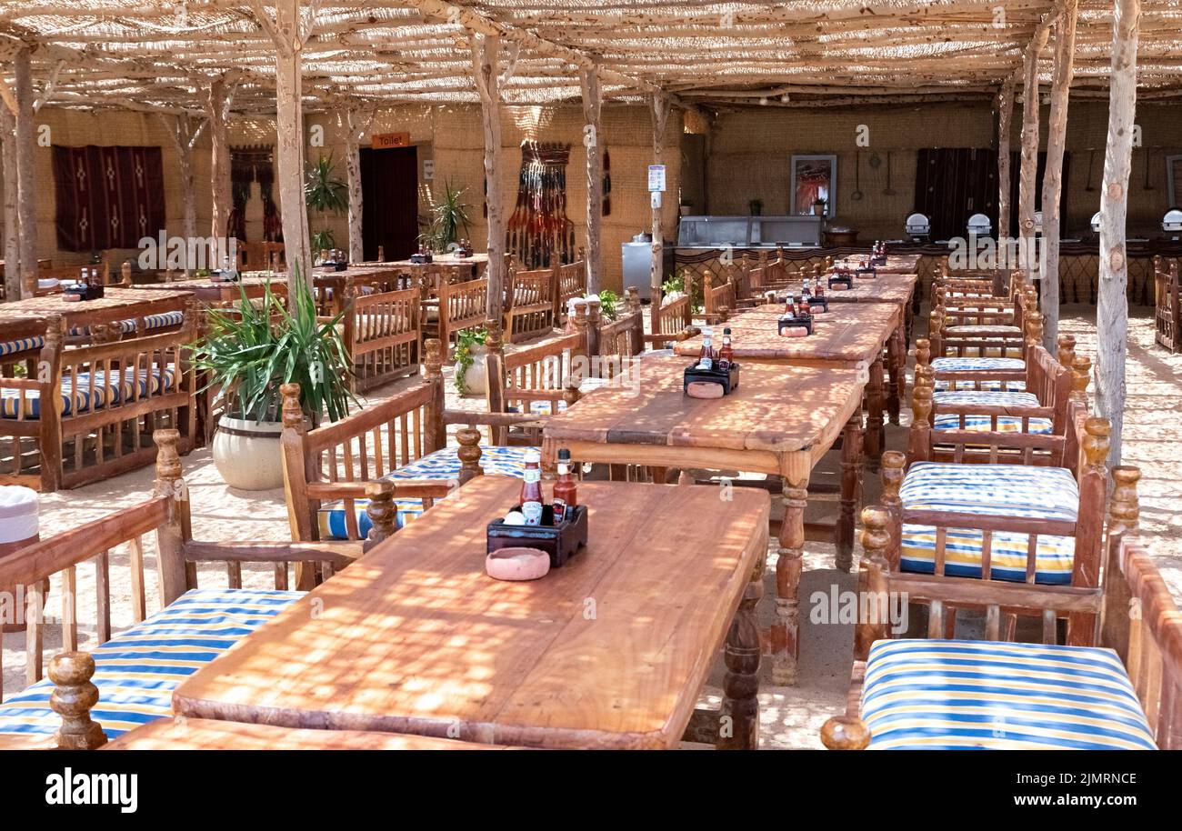 Hurghada, Egypt - August 29, 2021: Restaurant on the beach on a hot day by the sea. Holidays in Egypt. Sunny day and rest on the beach. Stock Photo