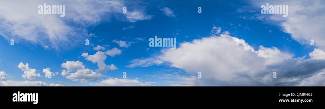 White clouds in blue summer sky panoramic  background Stock Photo