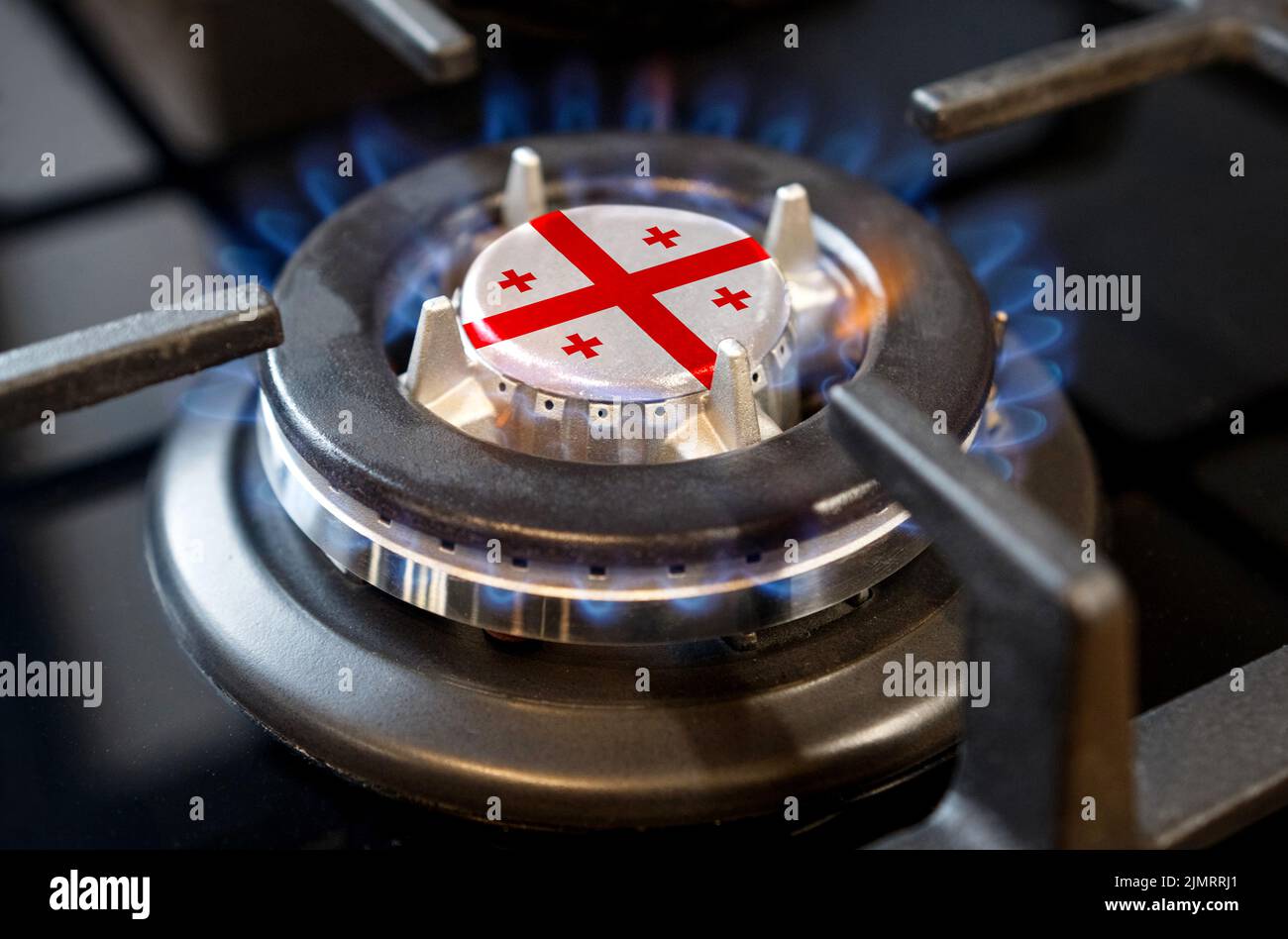 Gas import and export concept. A burning gas burner of a home stove, in