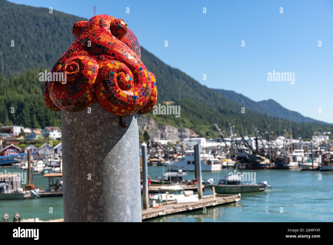The mosaic octopus sculpture by artist Terry Pyles on a piling cap along the Thomas Basin in Ketchikan, Alaska. Stock Photo
