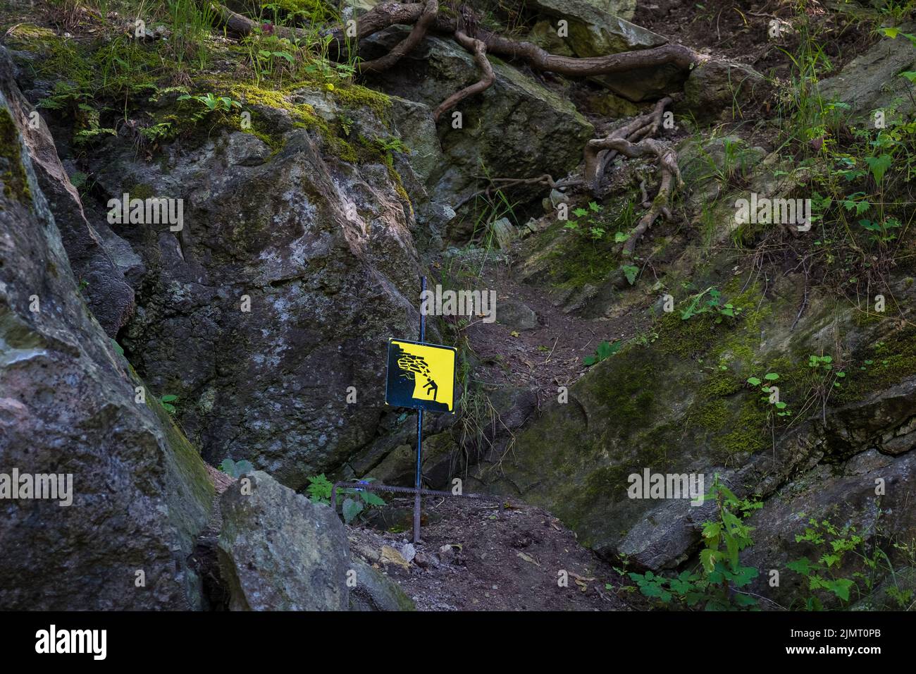 Danger of falling on rocks. No climbing sign in nature. Stock Photo