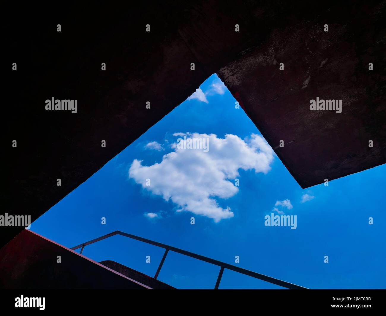 A low angle of clouds in the sky and stairs of a building Stock Photo ...