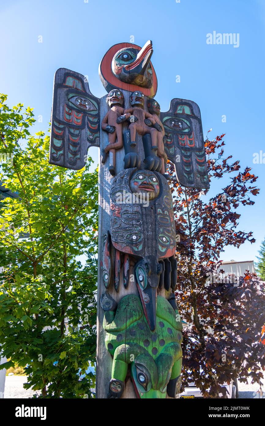 Detail of the Native Alaskan totem pole called Sun Raven Native American Totem Pole, outside the Totem Heritage Center in Ketchikan, Alaska. Stock Photo