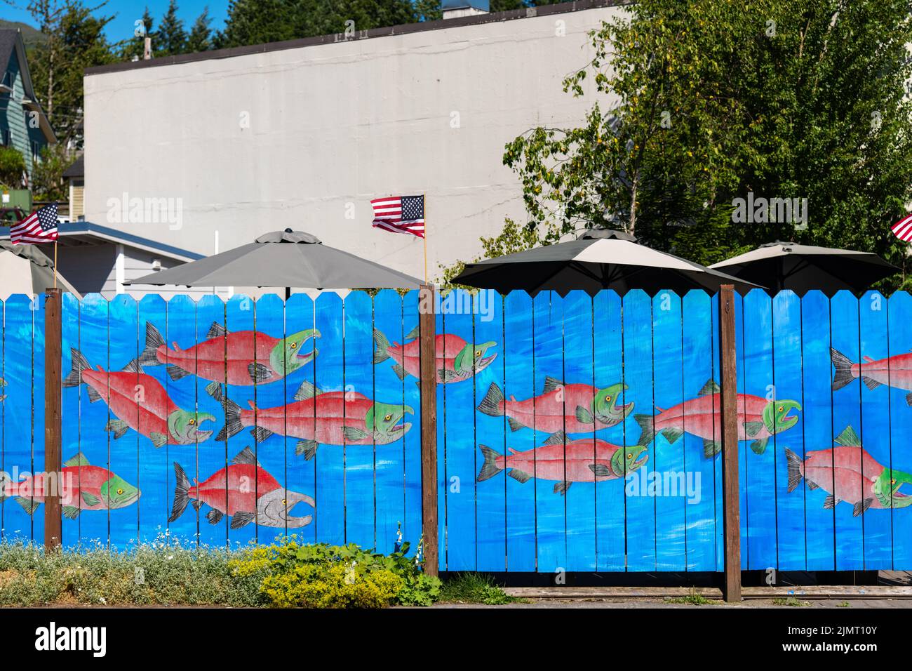 Salmon painted on a fence in the historic district of Ketchikan, Alaska. Stock Photo
