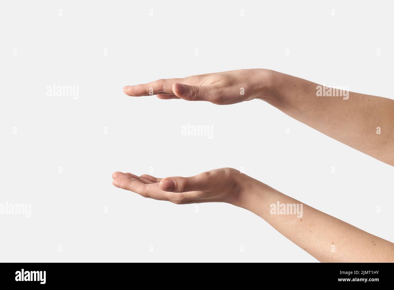 Two female open hands gesturing on white. Stock Photo