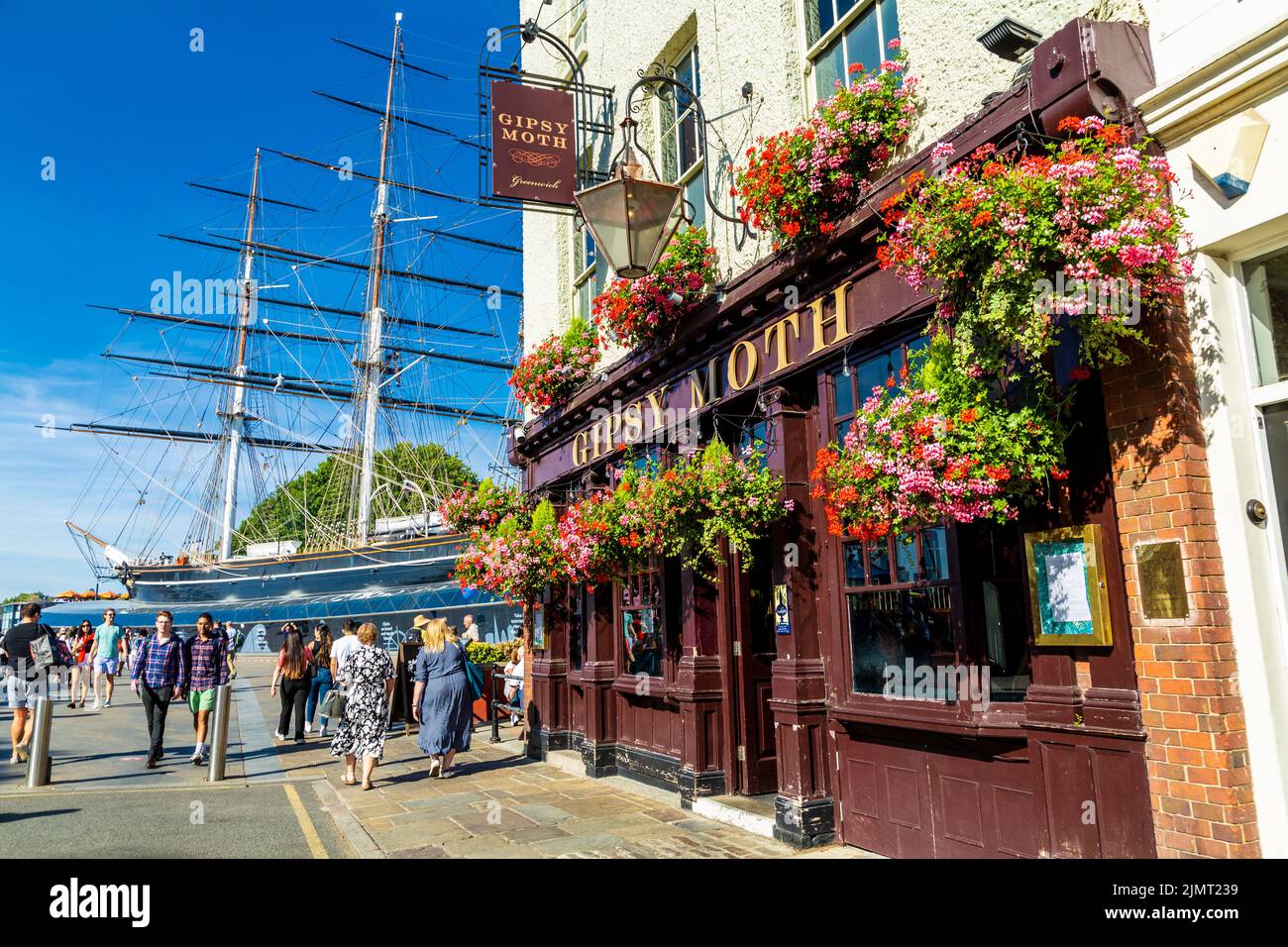 Exterior of Gipsy Moth pub and the Cutty Sark in Greenwich, London, UK Stock Photo