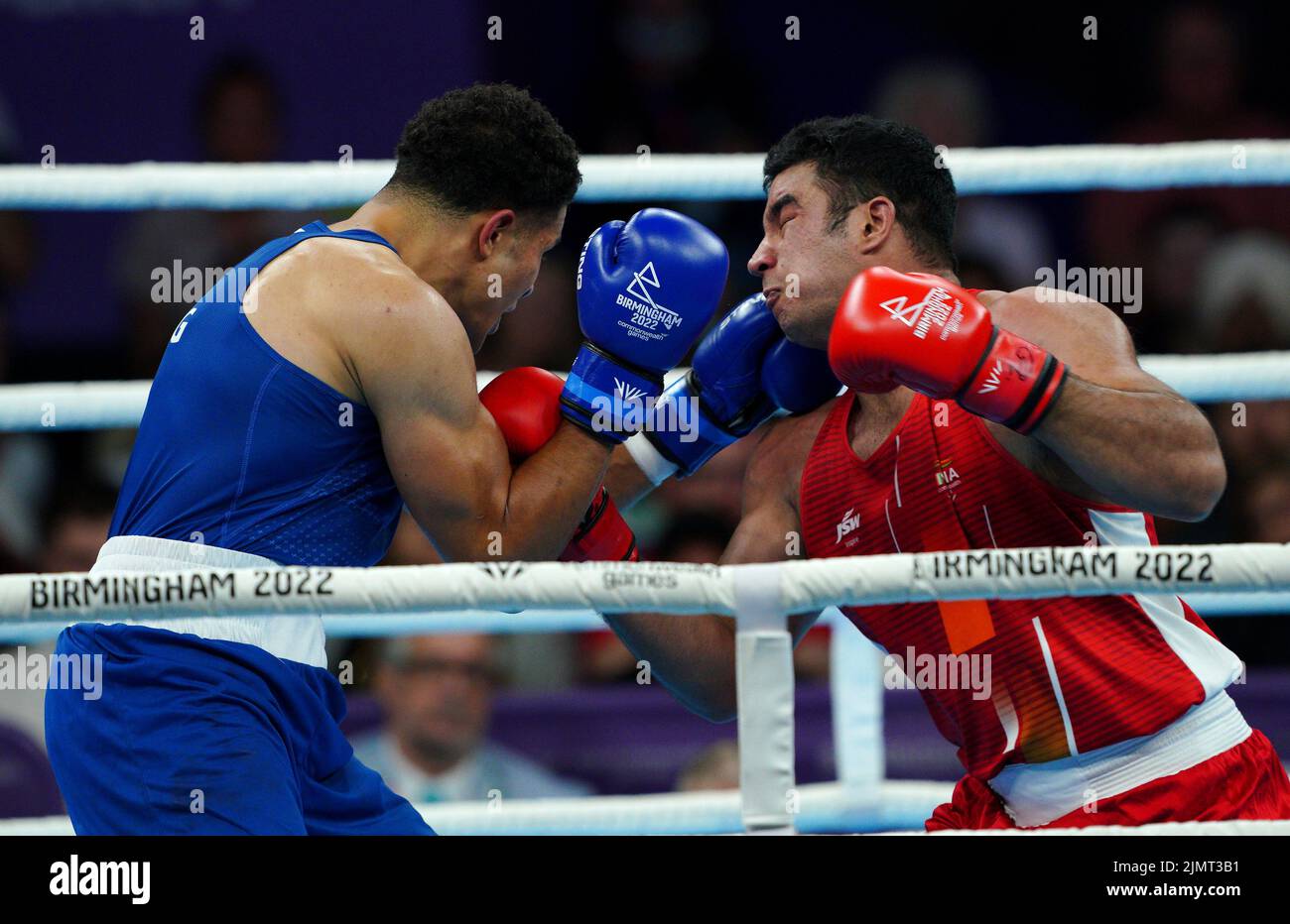 England's Delicious Orie (left) in action against India's Sagar Sagar during the Men's Super Heavy (+92kg) Final at The NEC on day ten of the 2022 Commonwealth Games in Birmingham. Picture date: Sunday August 7, 2022. Stock Photo