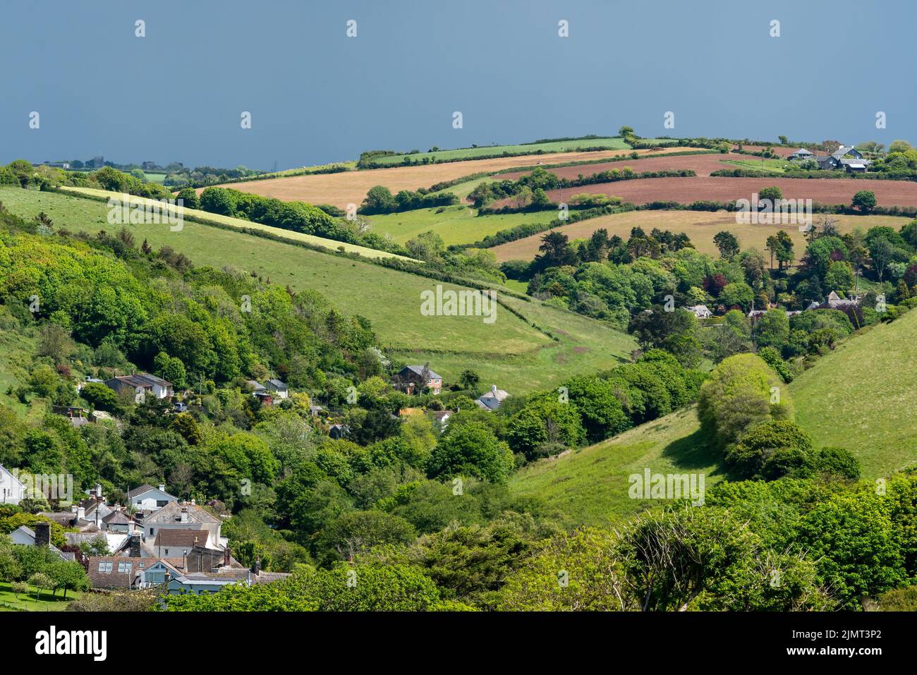 View from the South West Coastal Path near Thurlestone towards Buckland village in Devon Stock Photo