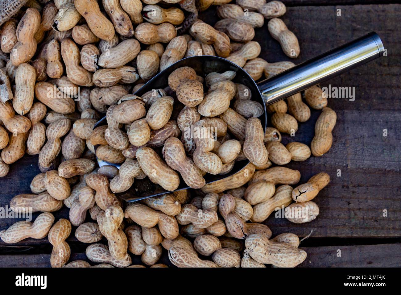Bag and shovel bucket with bulk peanuts Stock Photo Alamy