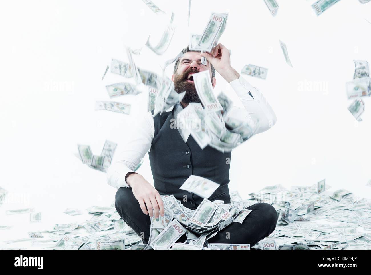 Rich bearded millionaire with banknotes. Businessman excited with money. Lottery. Bank advertising. Stock Photo