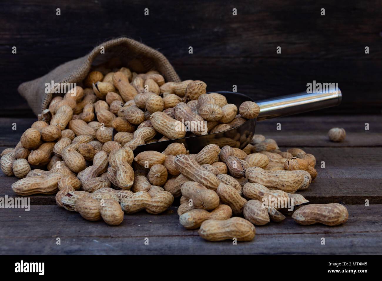Bag and shovel bucket with bulk peanuts Stock Photo Alamy