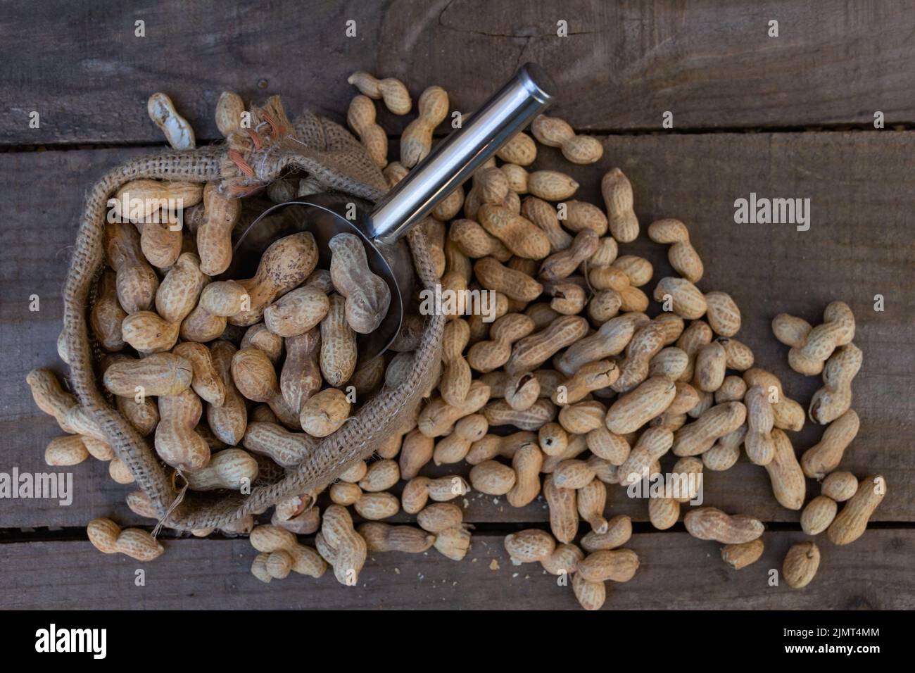 Bag and shovel bucket with bulk peanuts Stock Photo Alamy