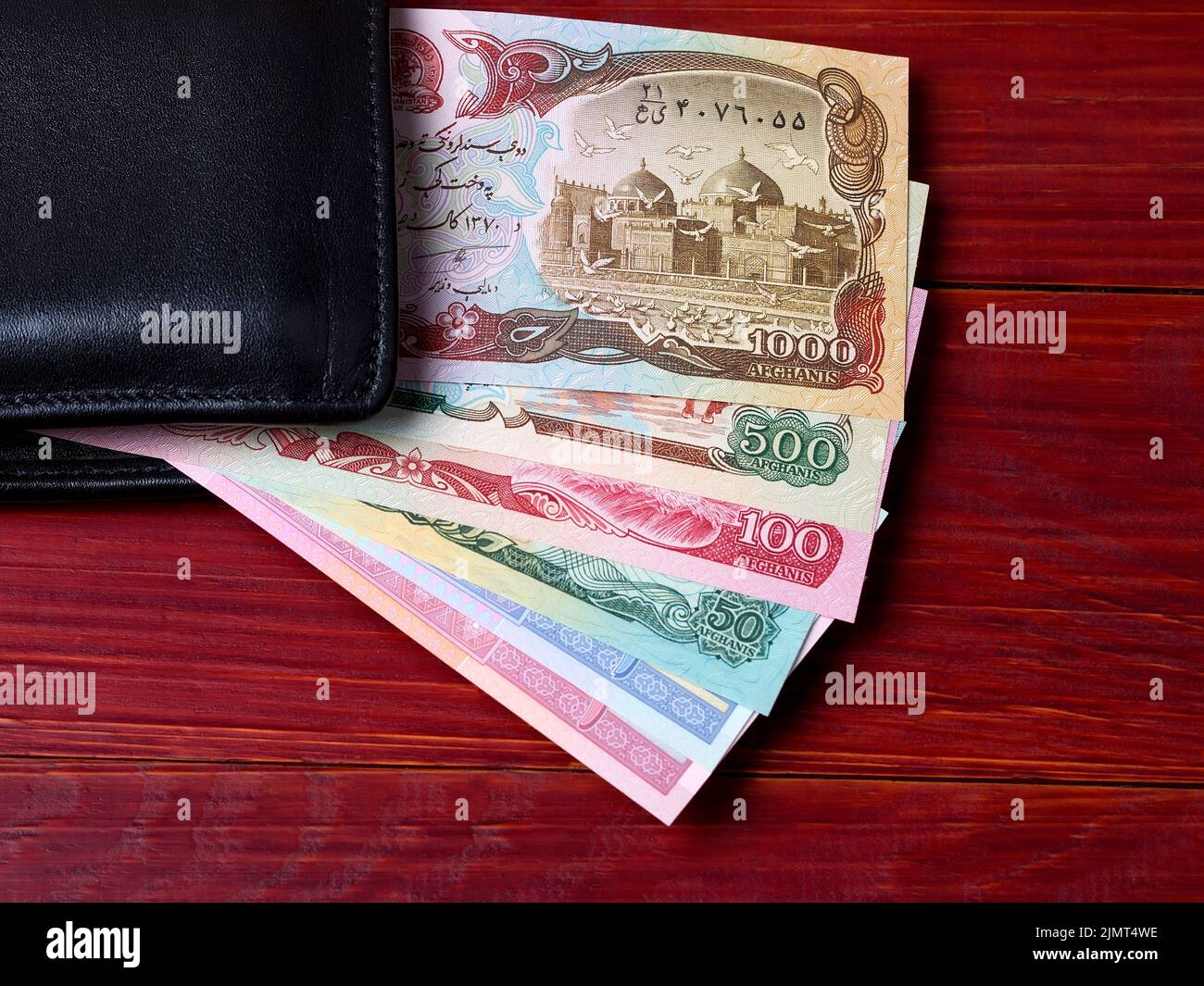 Afghan afghani in the black wallet Stock Photo