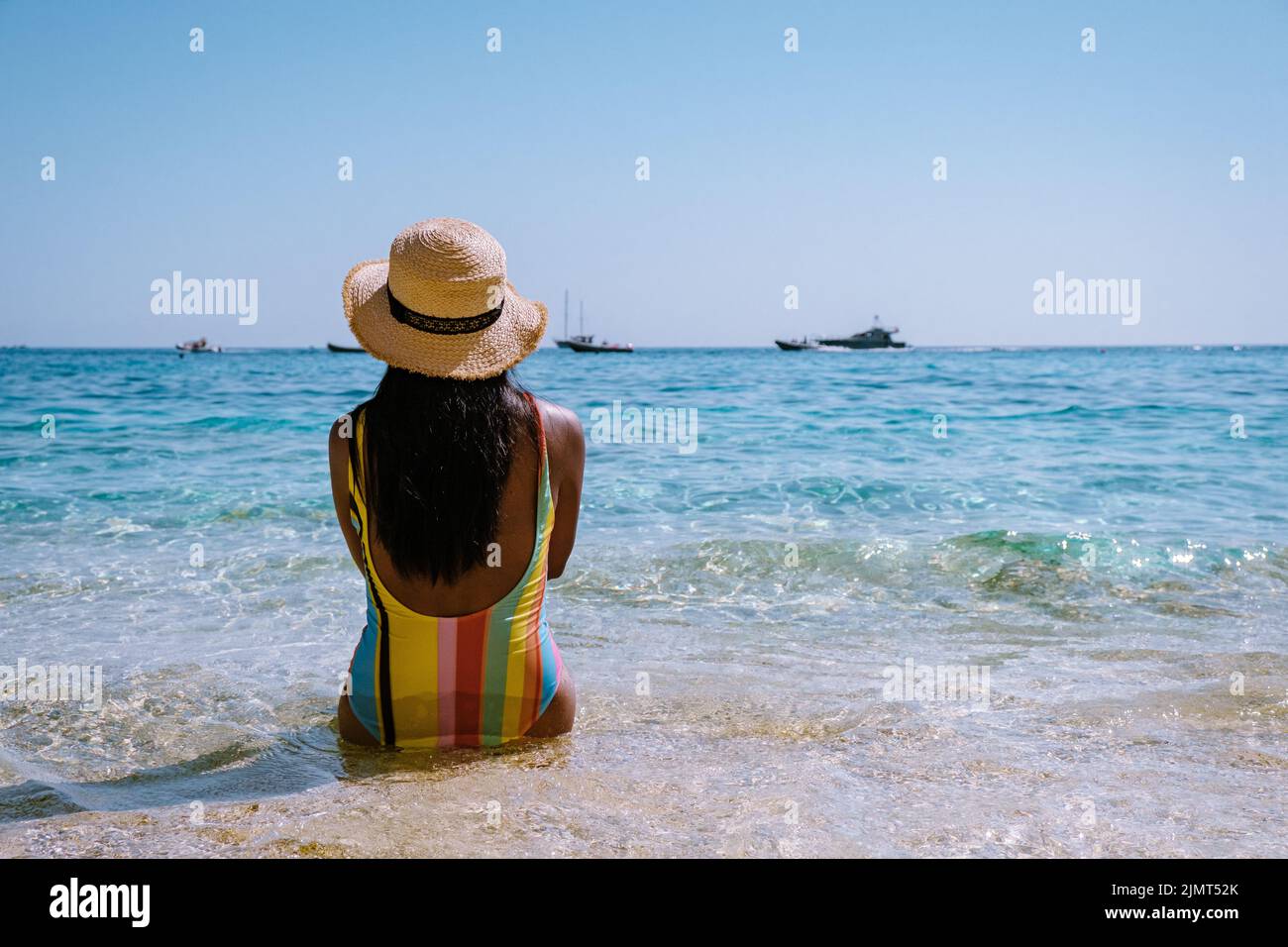 Golfo di Orosei Sardina, Asian women on the beach Sardinia Italy, young girl on vacation Sardinia Italy, woman playing in the oc Stock Photo