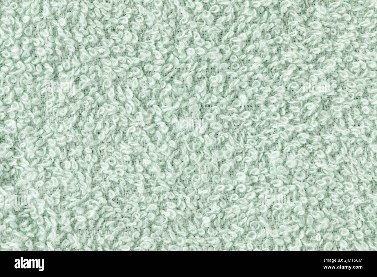 Mint green bath sheet or towels texture background. Bathroom body hygiene or spa concept. Close