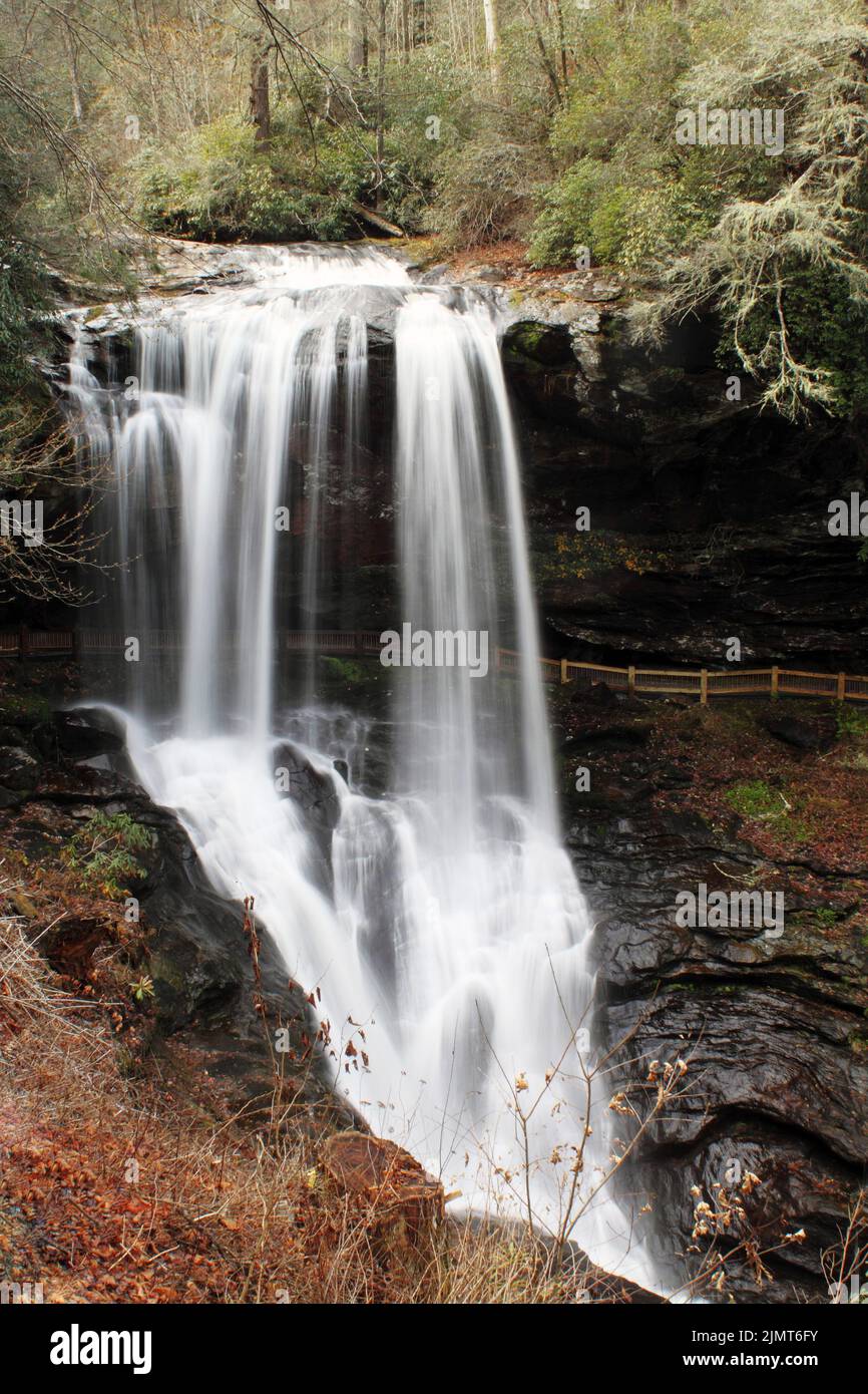 A beautiful view of a waterfall in a forest with trees Stock Photo - Alamy