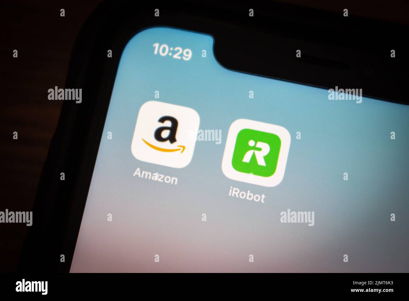 Vancouver, CANADA - Aug 6 2022 : Amazon and iRobot icons on an iPhone in a dark mood. In Aug 2022, they sign an agreement for Amazon to buy iRobot Stock Photo