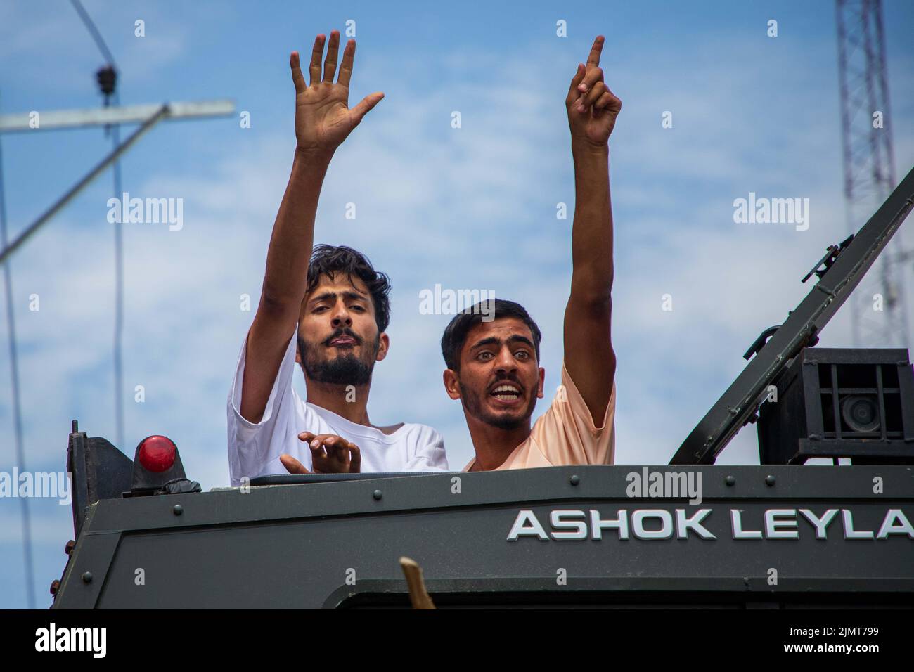 Kashmiri Muslim Shiite mourners chant religious slogans from the top of ...