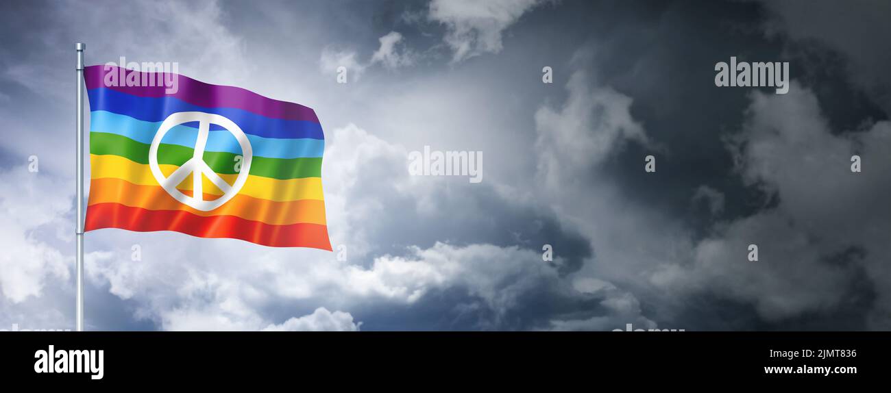 Rainbow peace flag on a cloudy sky Stock Photo
