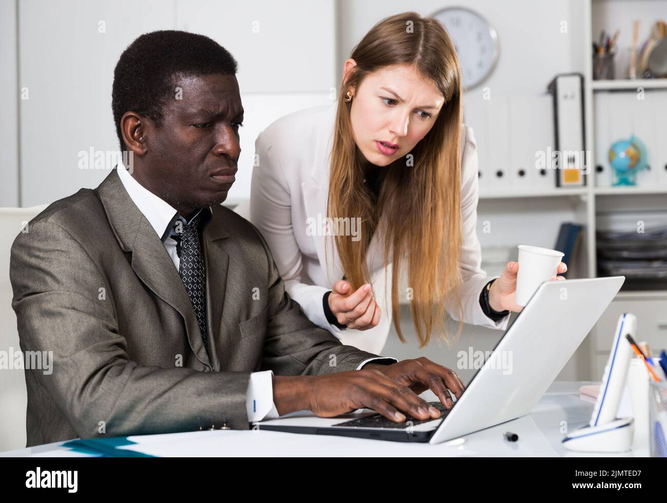 Focused coworkers working together Stock Photo