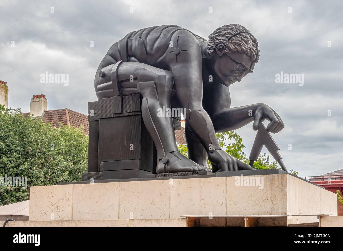 London, Great Britain - July 3, 2022: Closeup of gray Newton Statue on pedestal in front yard of British Library and Knowledge Center under gray cloud Stock Photo