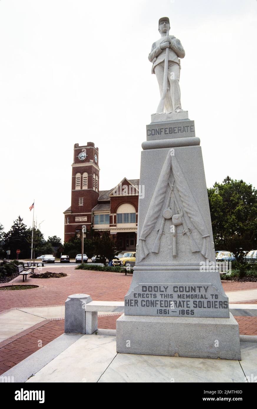 Confederate monument stands across from the Dooly County Courthouse in Vienna, Georgia. A likeness of a Confederate Army soldier stands . Stock Photo