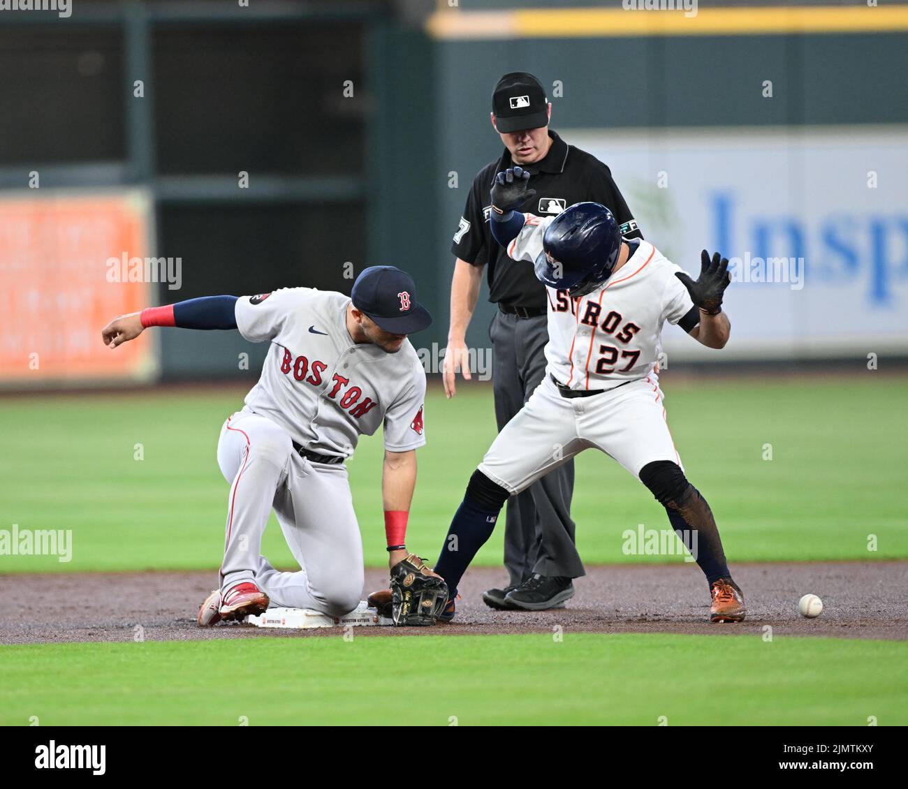Houston Astros second baseman Jose Altuve (27) is safe at second in the first inning of the MLB game between the Boston Red Sox and the Houston Astros Stock Photo
