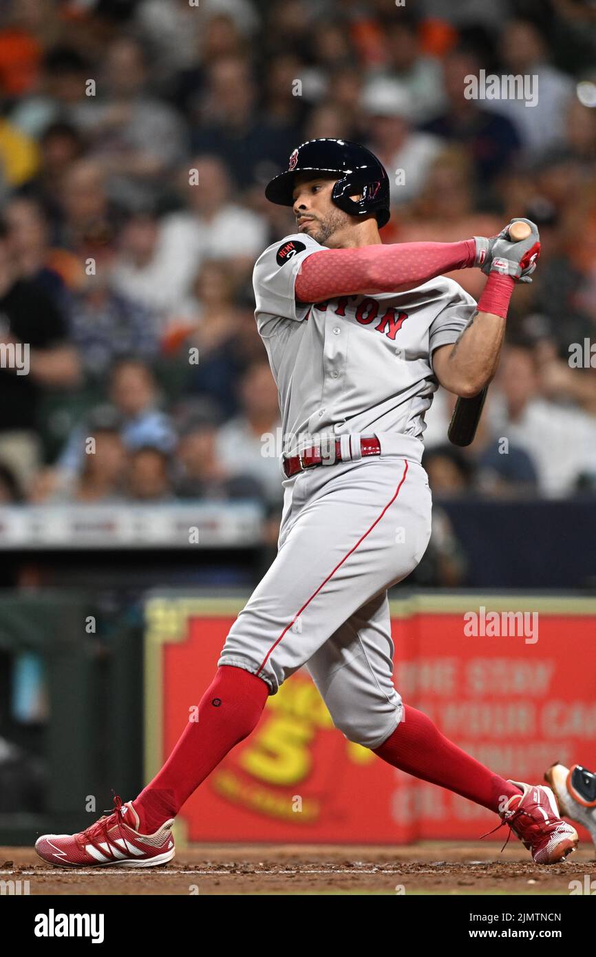 Boston Red Sox left fielder Tommy Pham (22) bats in the fourth inning of the MLB game between the Boston Red Sox and the Houston Astros on Tuesday, Au Stock Photo