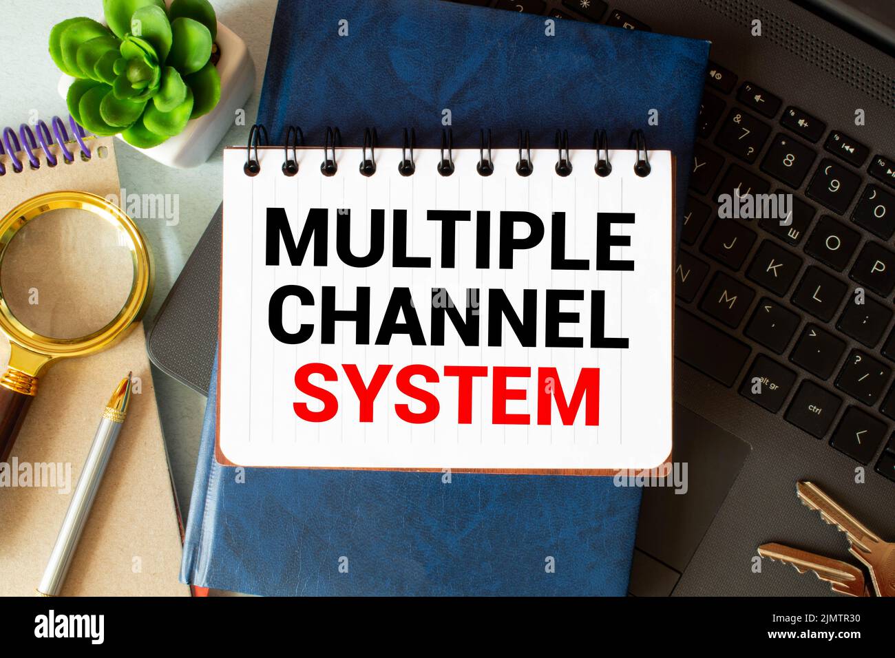 text Multiple Channel System on white business noteboock, concept. Stock Photo